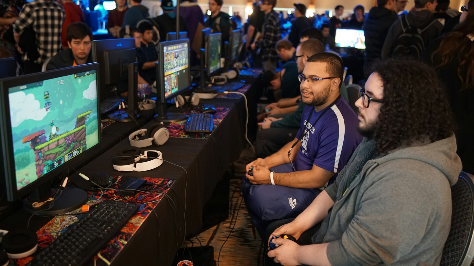 A focused gamer mid-session lit by monitor glow